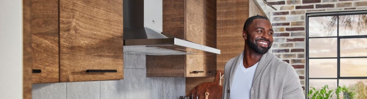 man standing in front of stainless steel vent hood